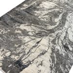 The Milat Aspendos rug makes a striking centrepiece with its flowing abstract design. Sweeping lines and textured patches move across the rug in cream and anthracite, creating a layered look that feels almost like a piece of art. The dark tones give the design depth, while the lighter areas keep it balanced and easy to pair with your furniture. Made from acrylic and viscose, this rug has a subtle sheen that brings out the contrast in its pattern as the light changes. Its generous 200 × 290 cm size works beautifully beneath a sofa and coffee table or as a focal point in a bedroom. Pair it with neutral furniture for a calm, modern look, or use it to tie together a room with darker accents. Color: Cream Size: 290 x 290cm Make: Machine-made Made In: Turkey Material: Acrylic & Viscose Note to Customers: Carefully measure your space before purchasing to ensure the rug fits your desired area. Colors may slightly vary due to lighting and monitor settings.